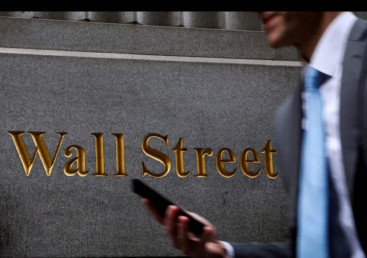 Dow, S&P 500 manage record closing highs; Nasdaq falls in volatile session